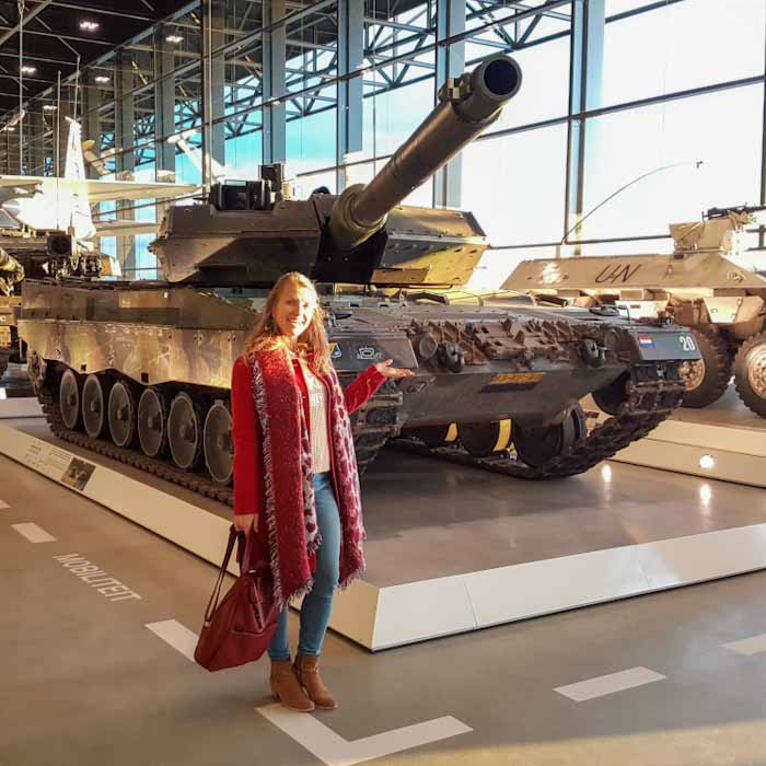 National Military Museum - stansing next to an old tank - Discover True Netherlands
